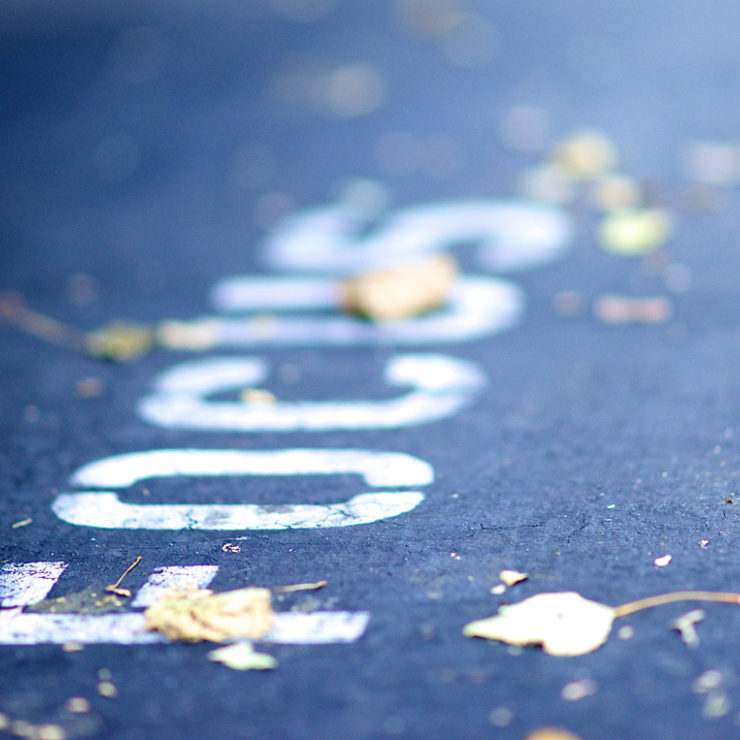 The word "focus" written on pavement