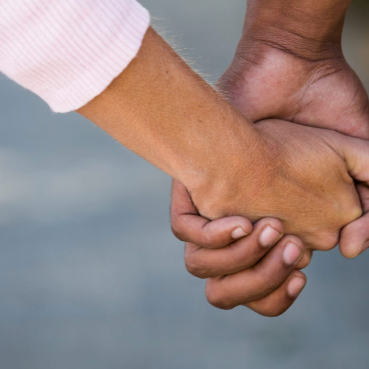 Hands holding to demonstrate compassion meditation