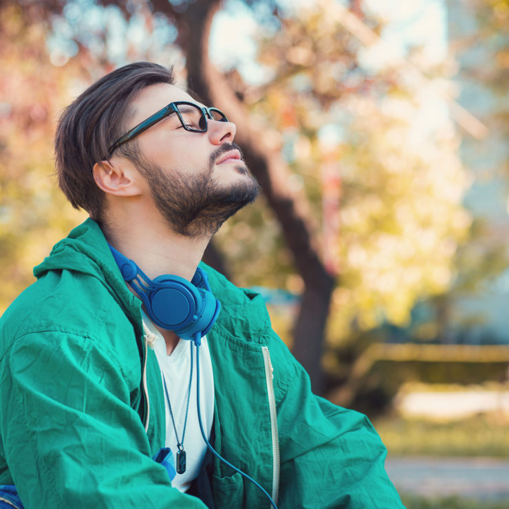 Photo Of A Man Sitting In A Nature With His Eyes Closed