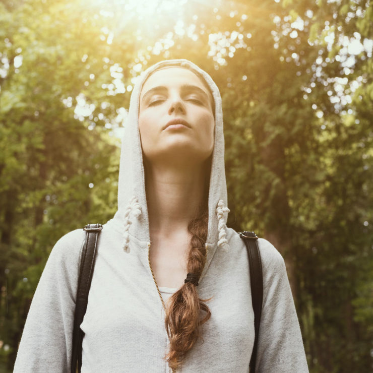 Woman Focusing On Her Breath In Nature