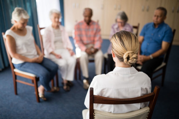 Circle Of People Meditating Demonstrating How Mindfulness Meditation Can Be A Tool For Treating Mental Illness