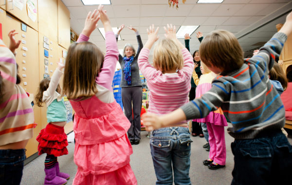 Young kids participate in mindful movement as part of Kindness Curriculum