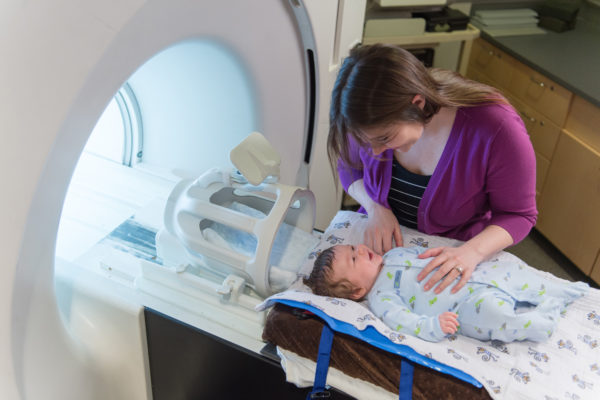 Infant and mother in imaging room for Baby Brain and Behavior Project