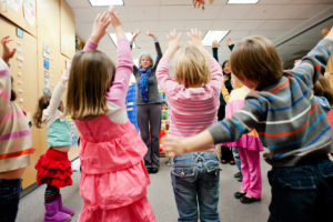 Young kids participate in mindful movement as part of Kindness Curriculum