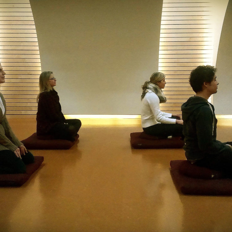 Photo of group meditating 