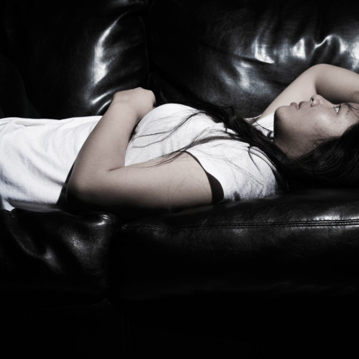 Photo of girl laying on a couch by Sodanie Chea via Flickr