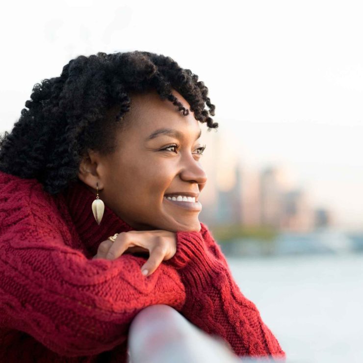 Woman Smiling Railing Outside Ridofranz I Stock