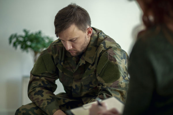 Veteran Talking To Therapist Seeking Mental Health Treatment