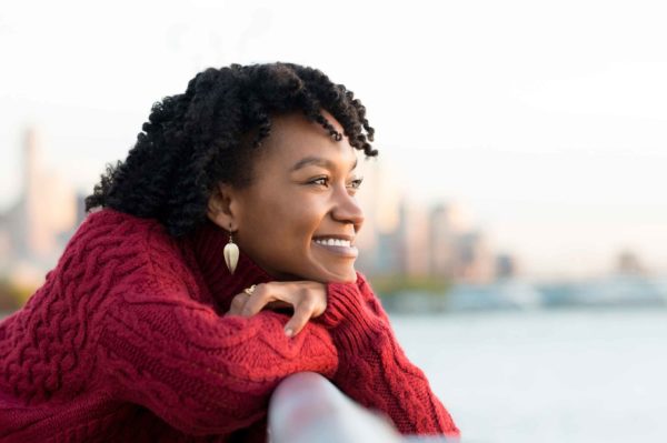 Woman Smiling Railing Outside Ridofranz I Stock