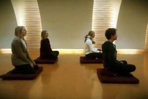 Photo of group meditating 